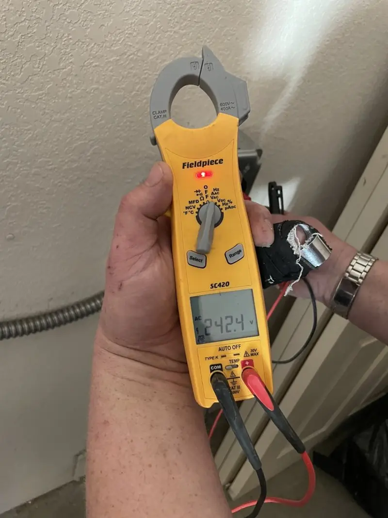 Voltage testing with clamp meter during Generator Installation in Brooklyn Park